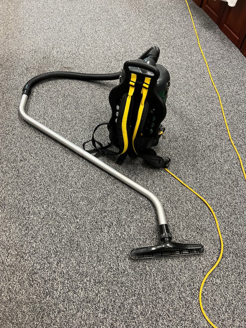 Backpack vacuum cleaning office carpet in Rochester Hills, MI